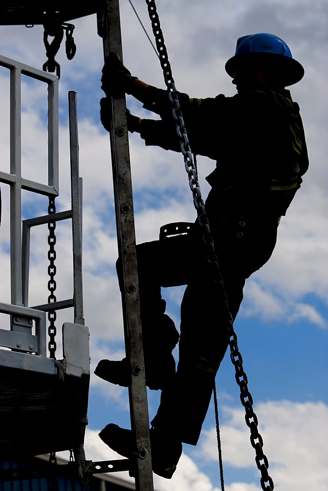 Worker climbing