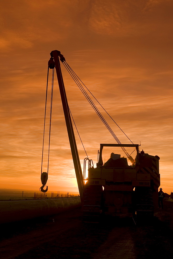 Heavy equipment at sunset