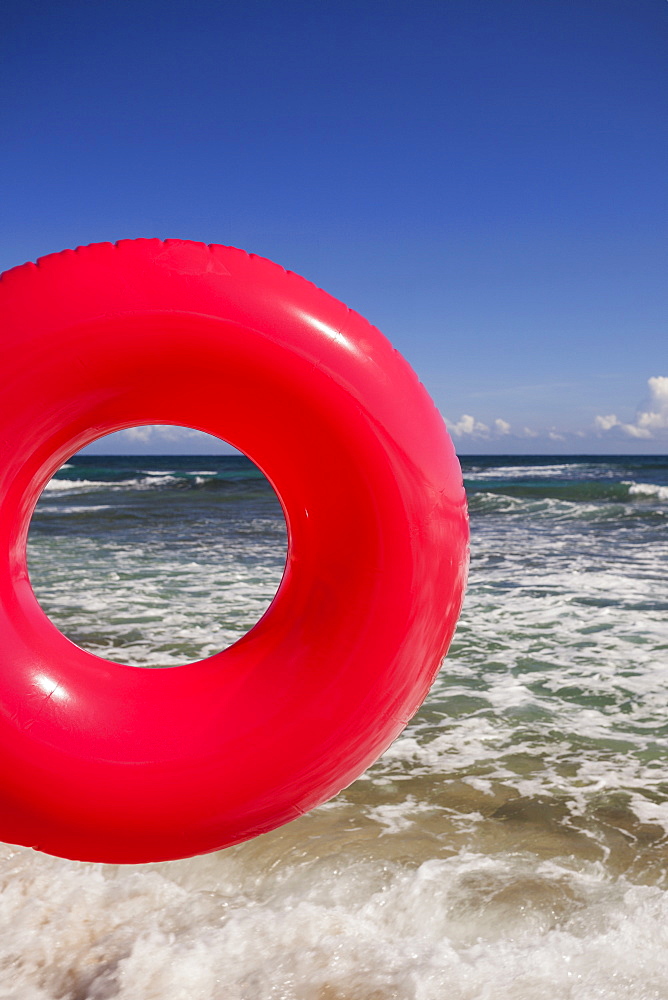 Red Inner tube at beach, Isabel Beach, Puerto Rico