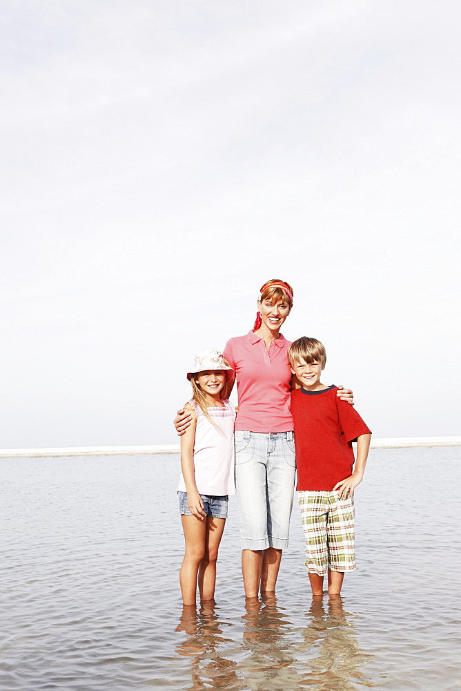 Family posing on beach