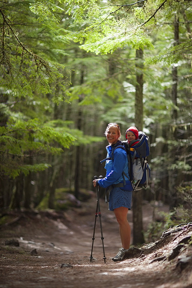 Woman with son (4-5) on trail of cedars, Trail of the Cedars, Glacier National Park, Montana, USA