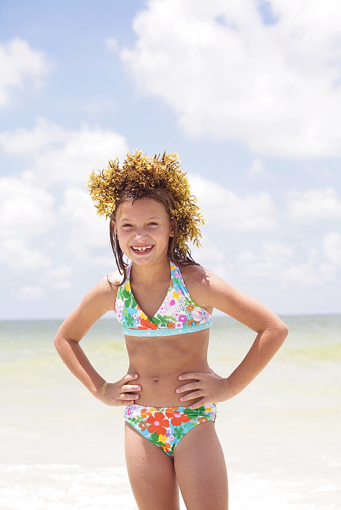 Girl posing with seaweed on head