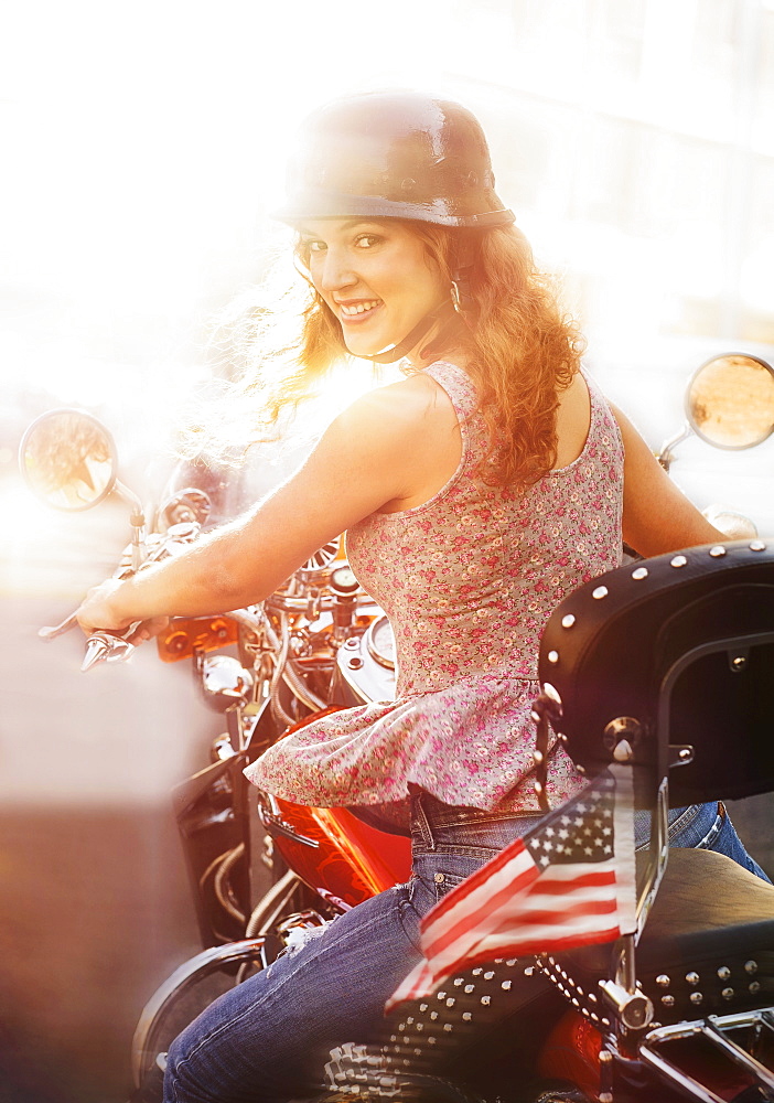 Young woman riding motorcycle