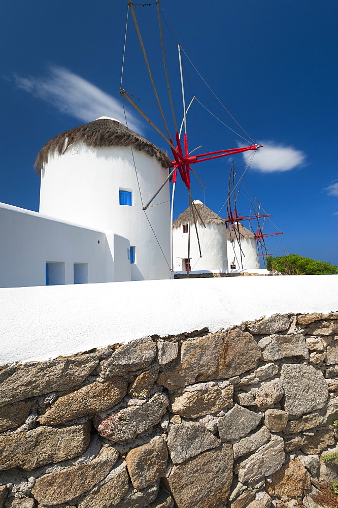 Greece, Cyclades Islands, Mykonos, Stone wall near old windmills