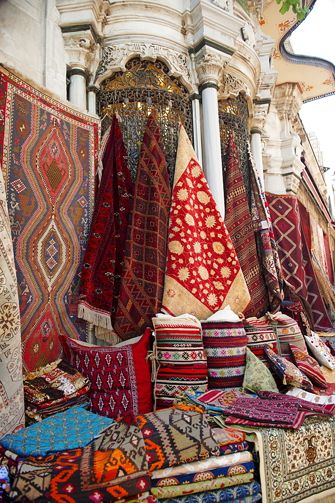 Turkey, Istanbul, Grand Bazaar, rugs and cushions for sale