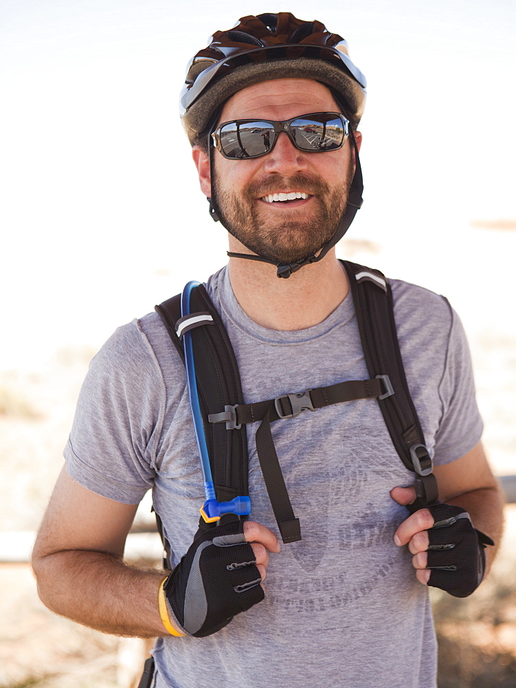 Mid adult man posing in cycling gear