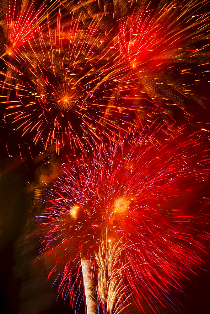 Fireworks explosion against night sky