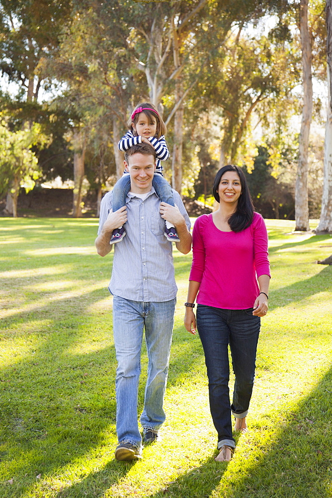 Portrait of happy family in park, Irvine, California