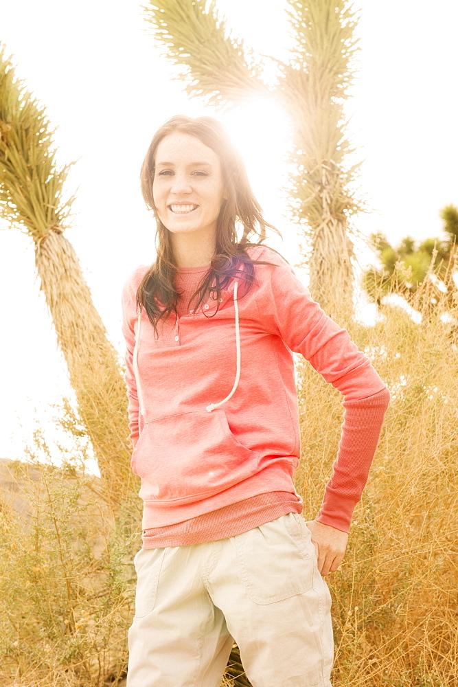 USA, California, Joshua Tree National Park, Portrait of young woman in desert, USA, California, Joshua Tree National Park