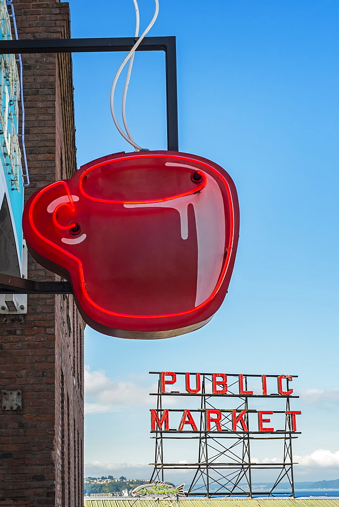 Neon coffee cup in front of cafe, low angle view, Seattle, Washington