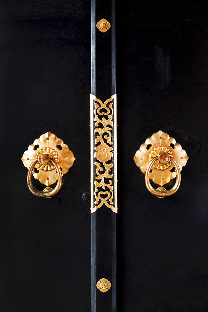 Close-up of ornate door handles