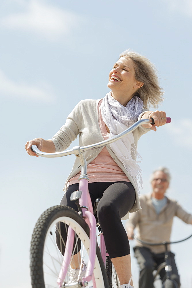 Senior couple riding bicycle