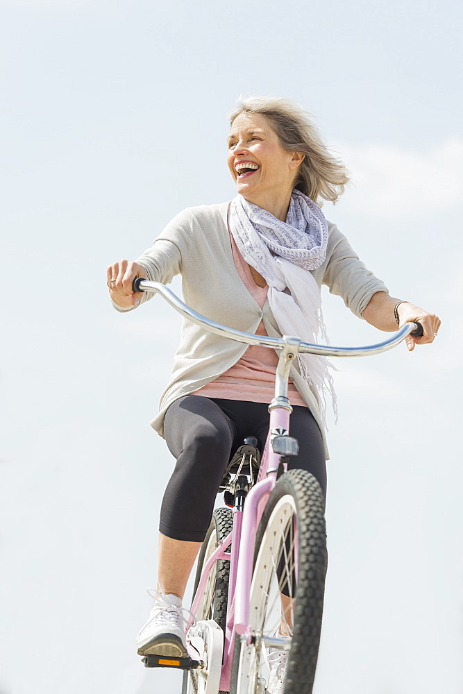 Senior woman riding bicycle