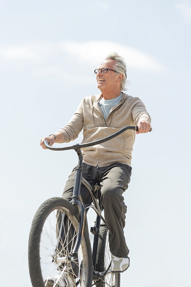 Senior man riding bicycle