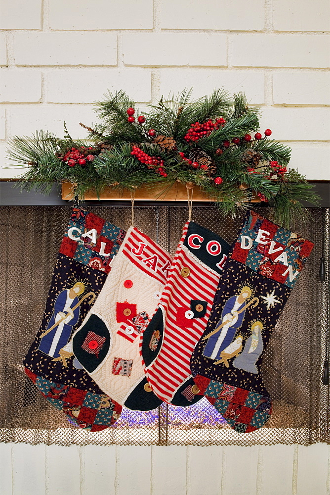 Christmas stockings hanging on fireplace