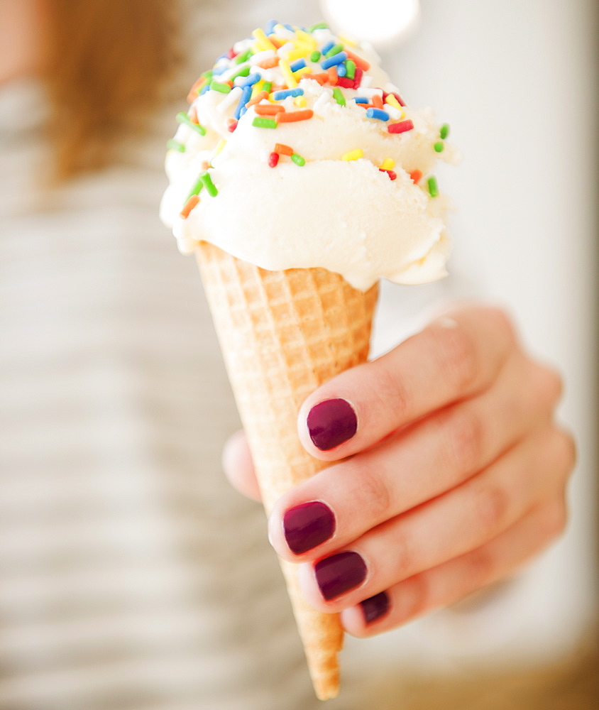 USA, Jersey City, New Jersey, female hand holding ice cream