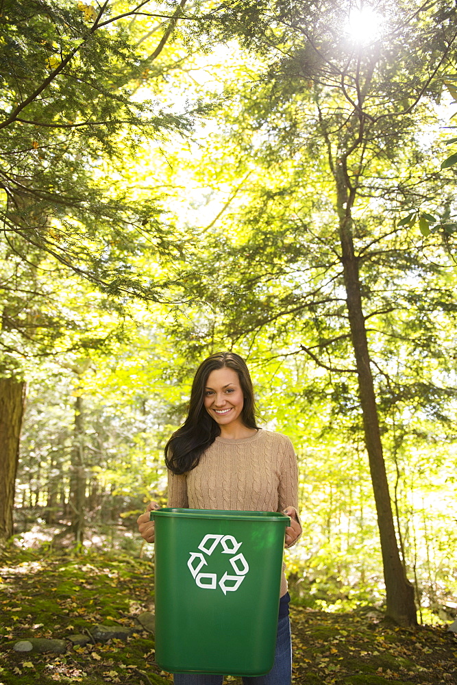 Woman holding recycling bin, Newtown, Connecticut