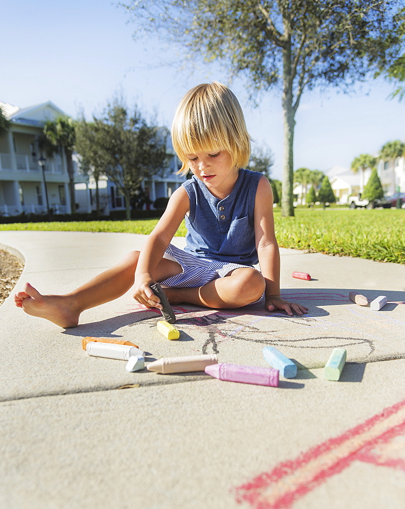 Boy (4-5) playing on playground, Jupiter, Florida, USA