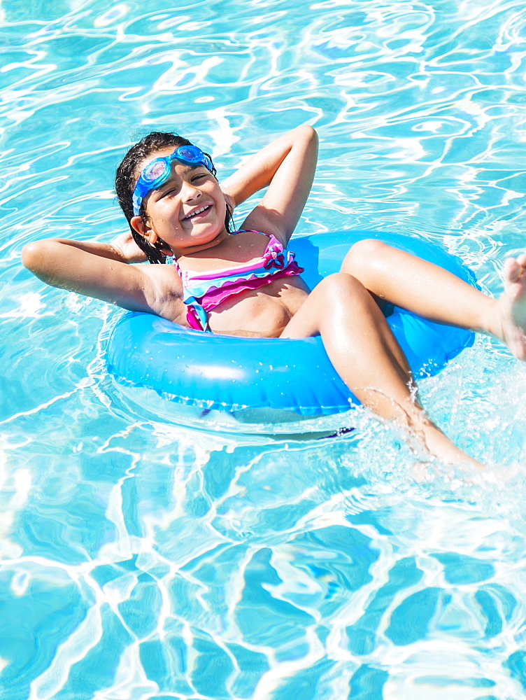 Portrait of girl ( 8-9) with inflatable ring