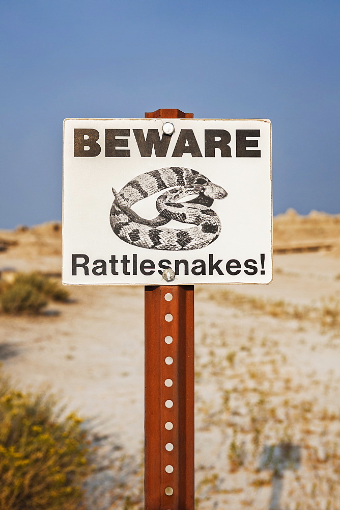 Beware snakes - warning sign, USA, South Dakota, Badlands National Park