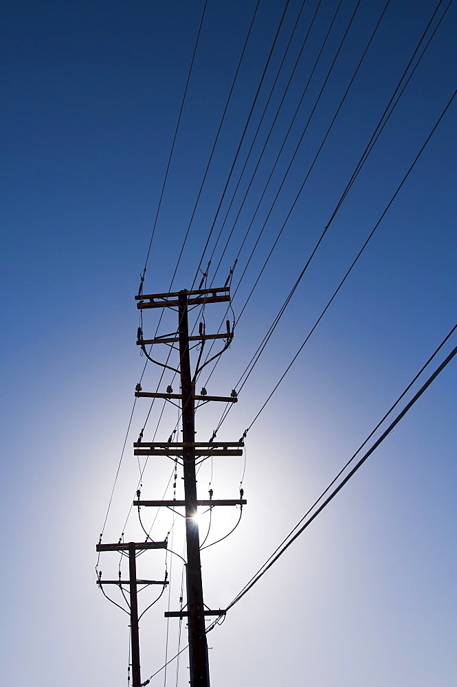 Power line against blue sky
