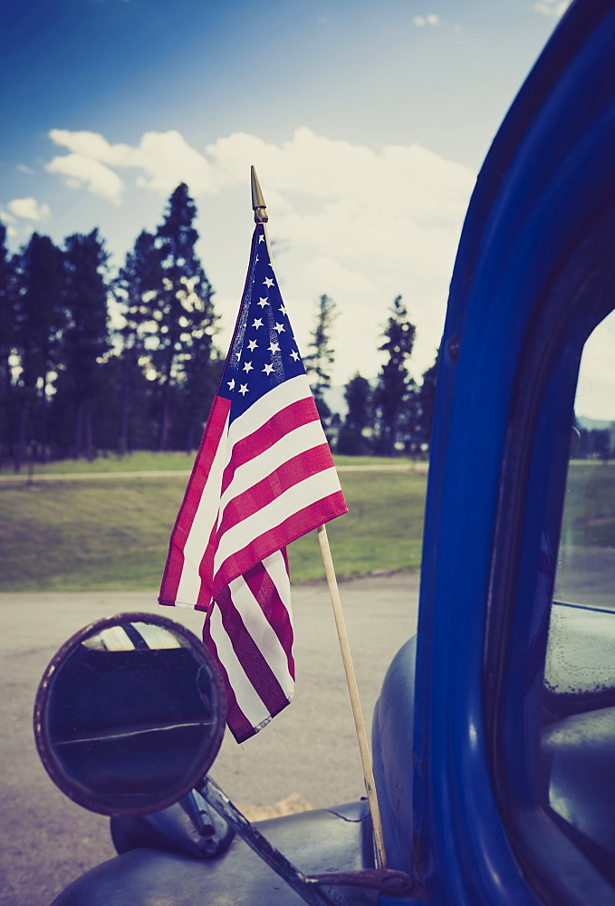 American flag attached to truck, Hill City, South Dakota