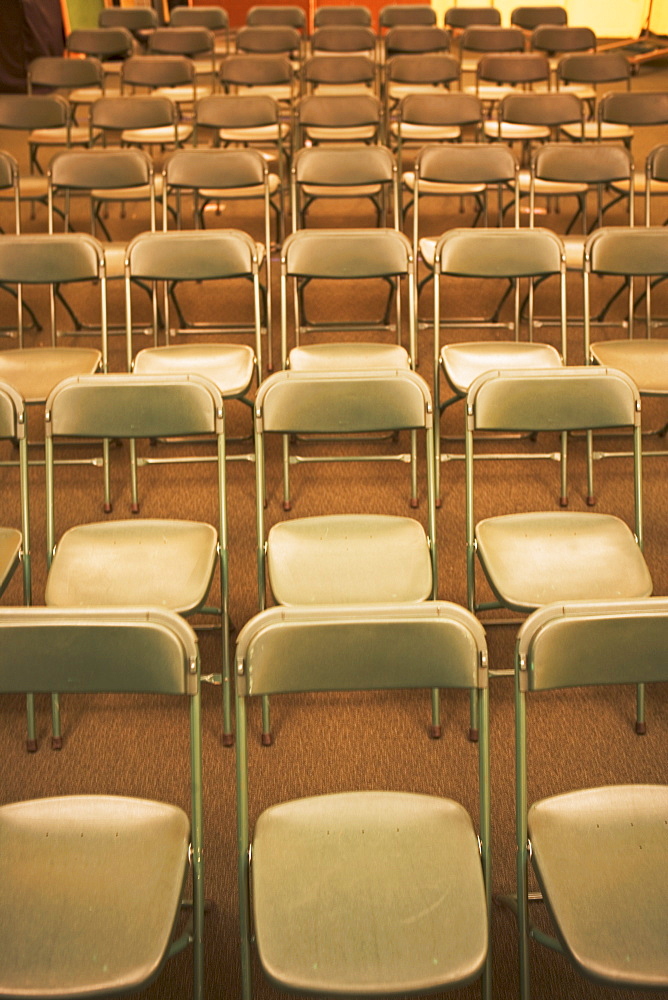 Empty folding chairs in rows