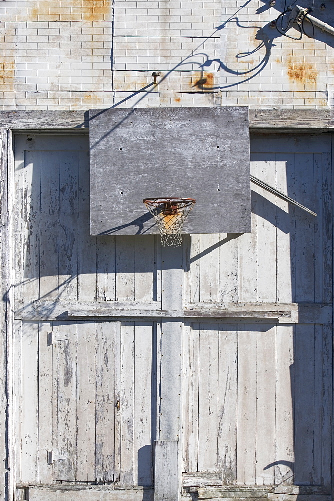 Basketball net on rustic building