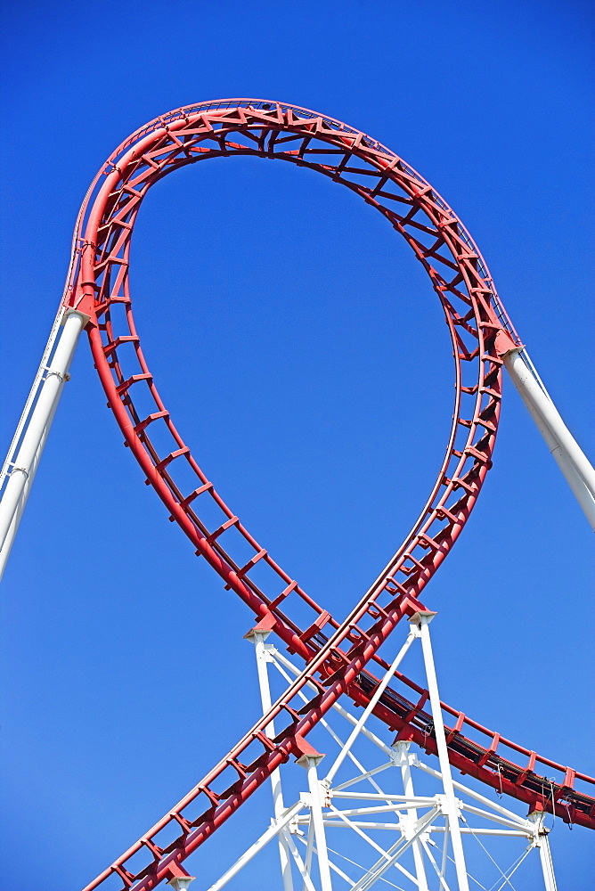 Rollercoaster against blue sky