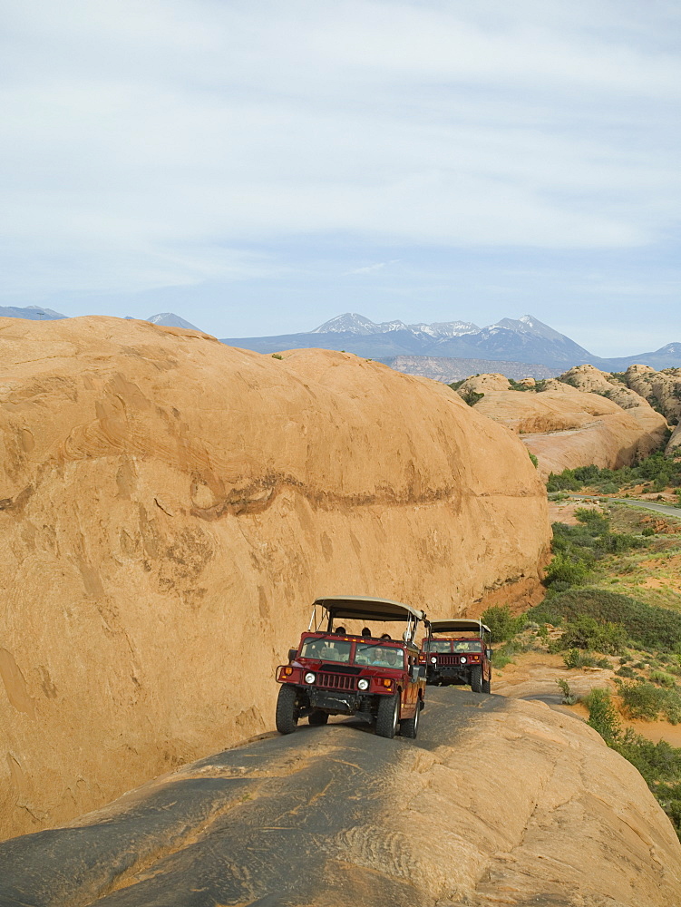 Off-road vehicles driving on rock formation