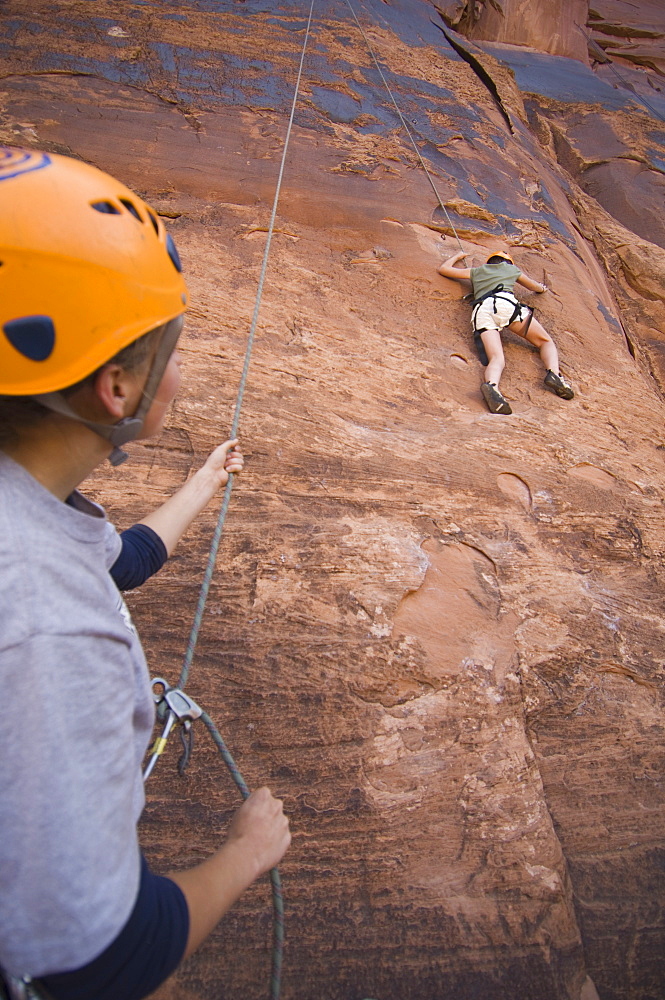 Two people rock climbing