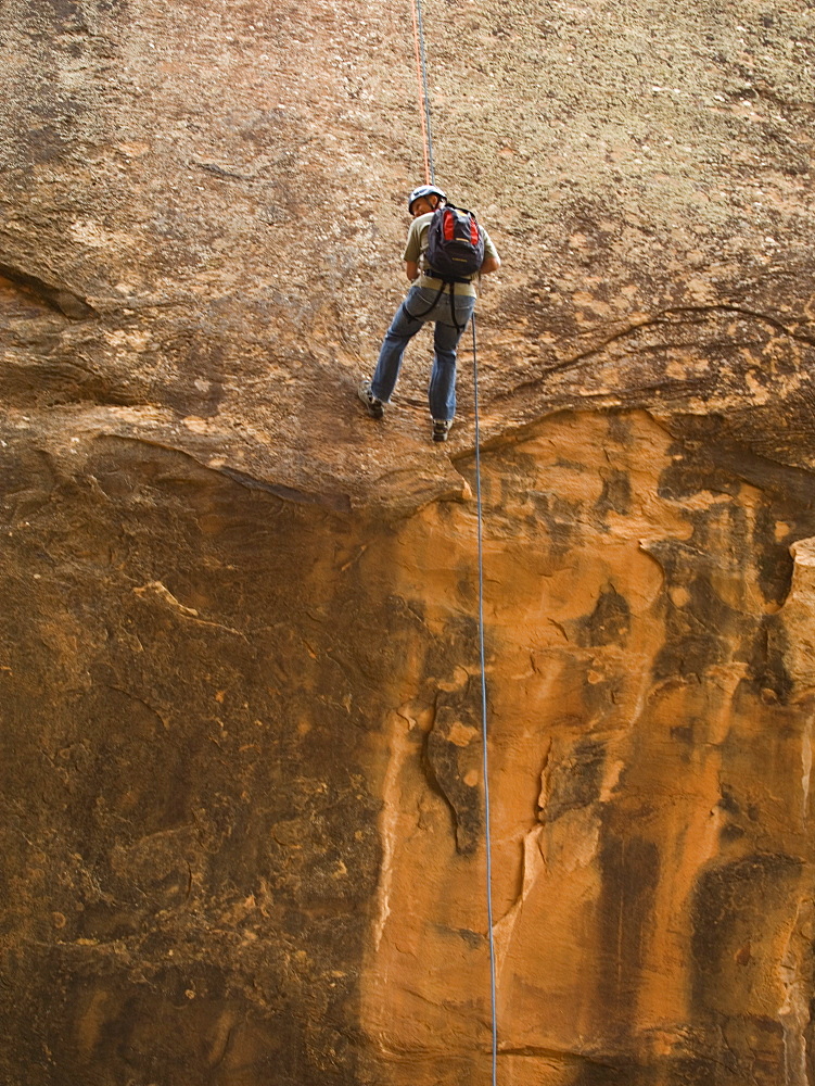 Man canyon rappelling