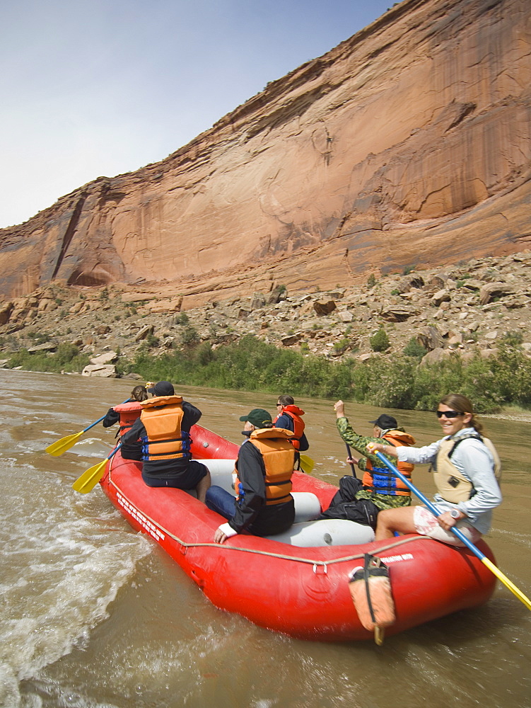 Group of people river rafting