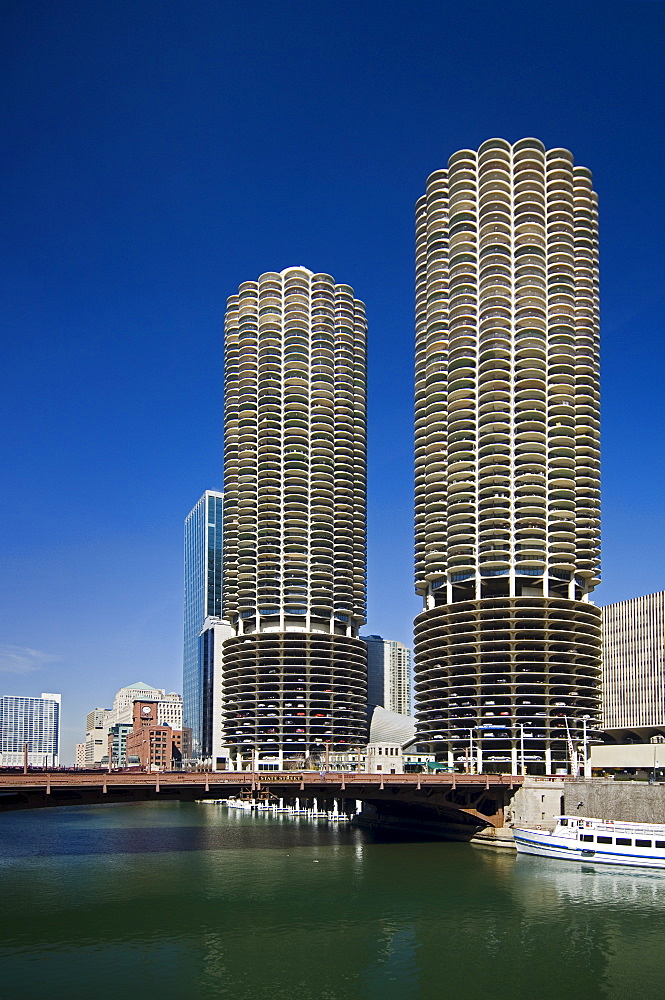 Marina City Towers with boat on Chicago River Chicago Illinois USA