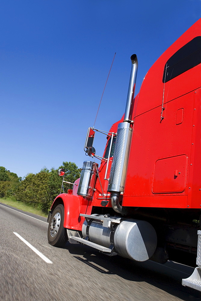 Large red truck on the highway