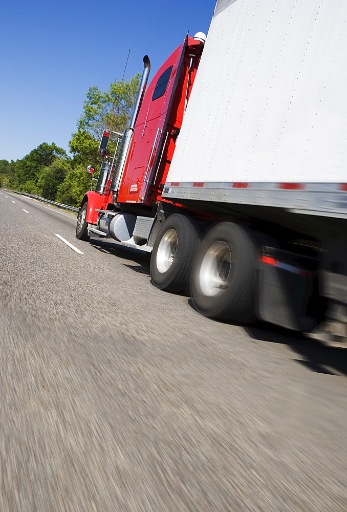 Side angle view of tractor trailer on highway