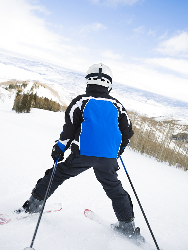 Child skiing downhill