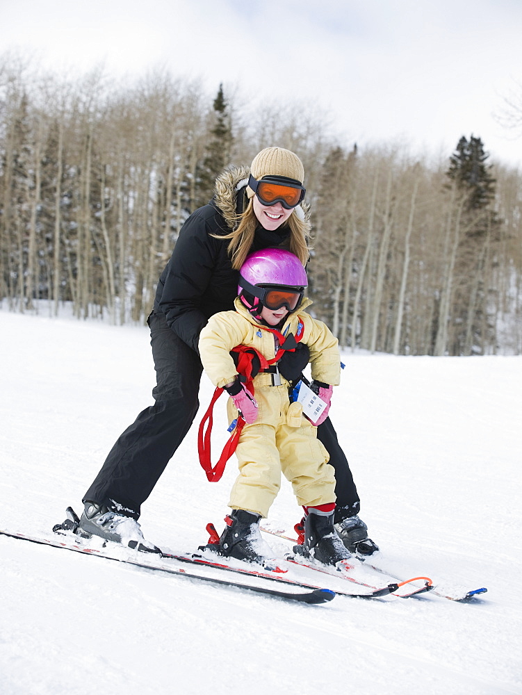 Mother and child skiing