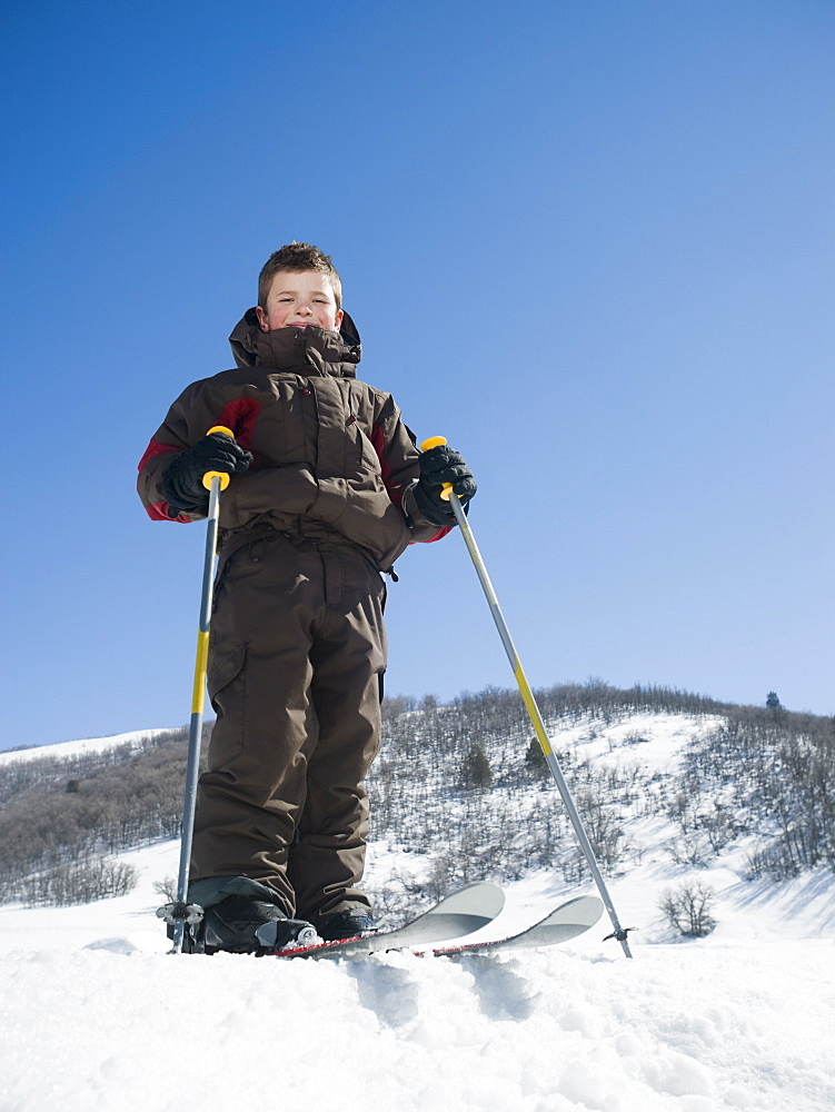 Boy standing on skis