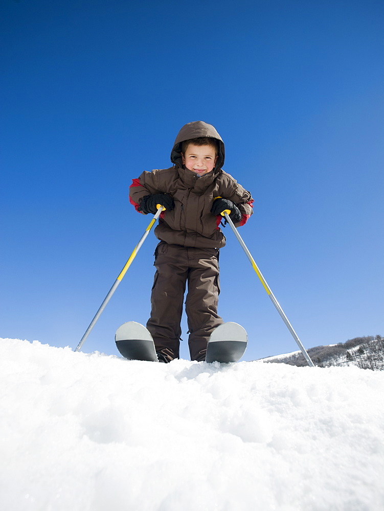 Boy standing on skis
