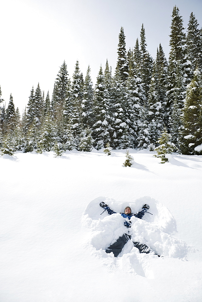 A person making snow angels