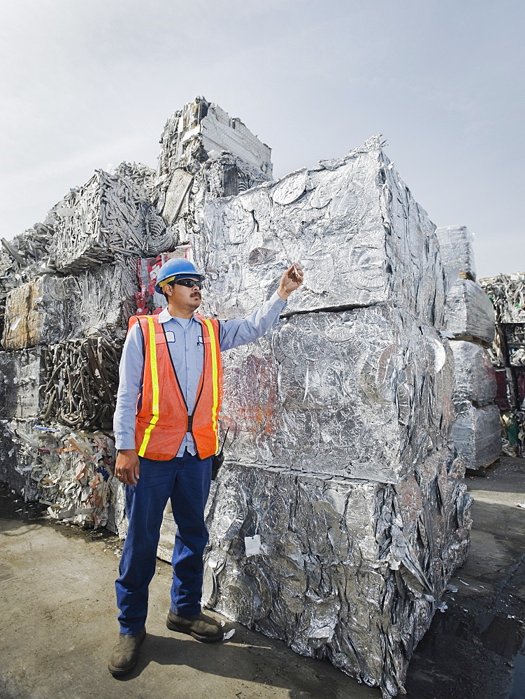 Worker at recycling plant