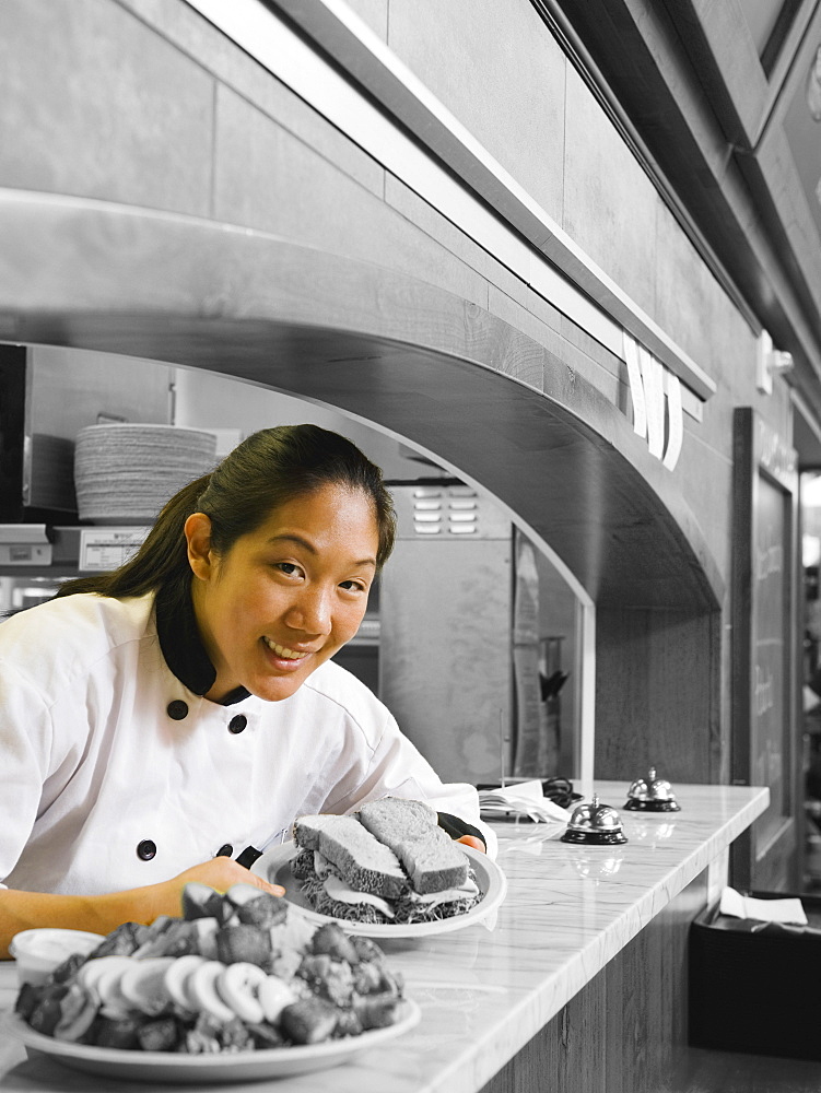 Chef leaning on counter