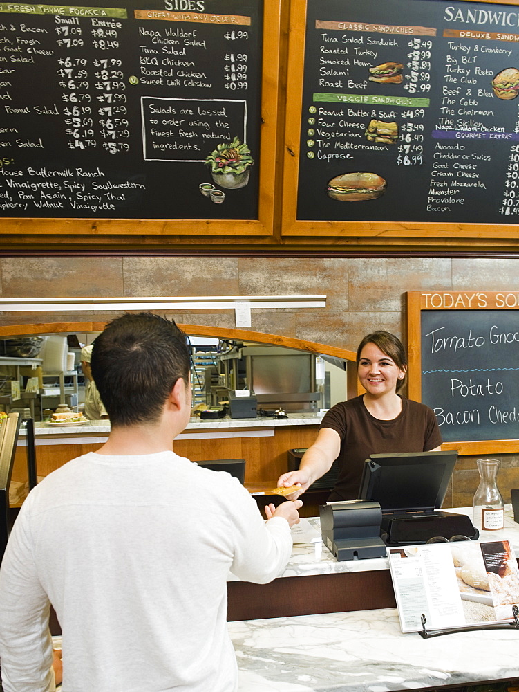 Customer paying for his bakery order