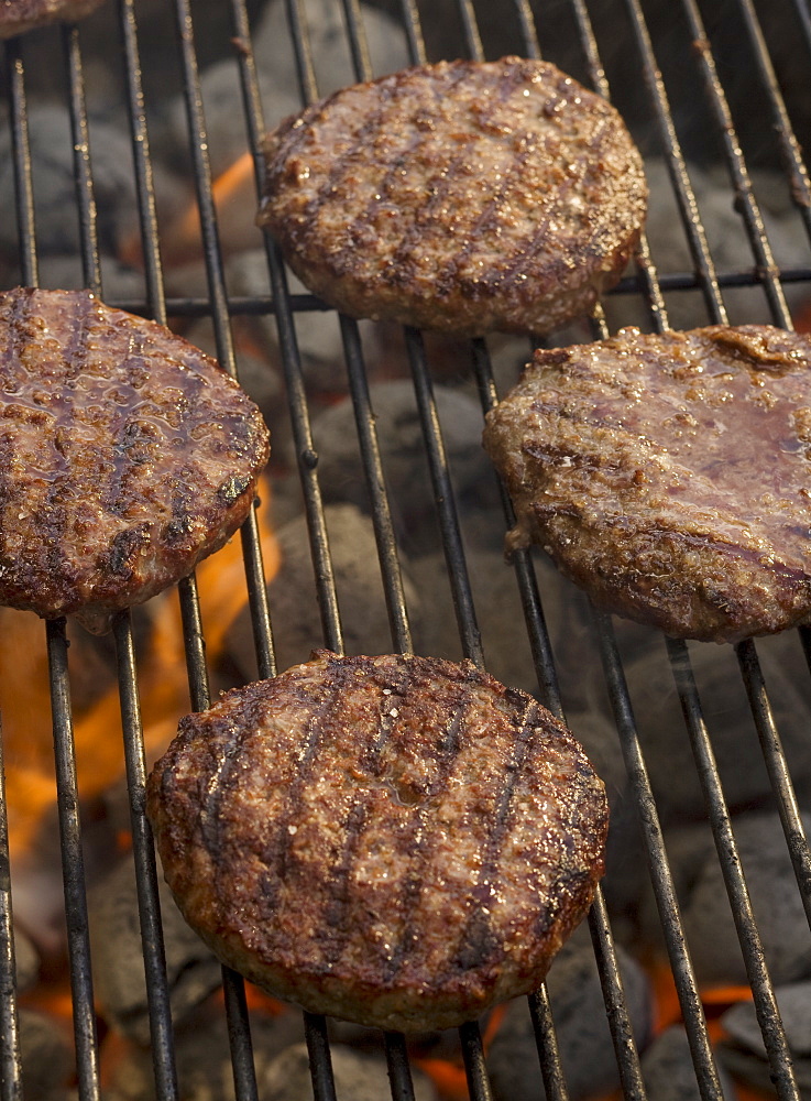 Hamburgers cooking on grill