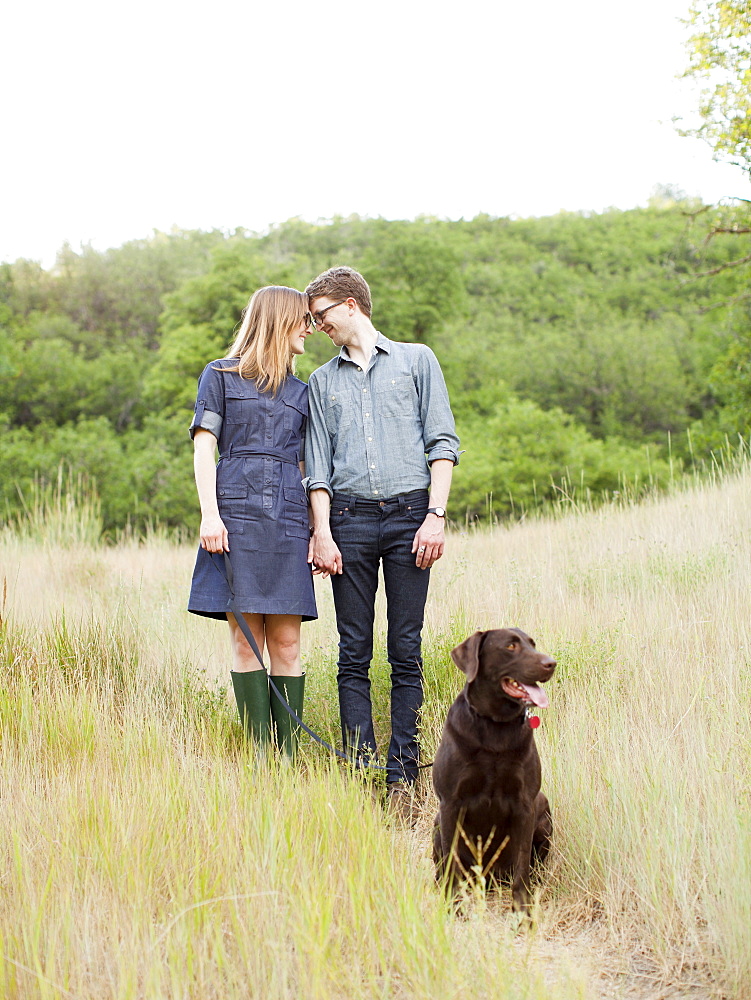 Portrait of young couple with dog, USA, Utah, Salt Lake City