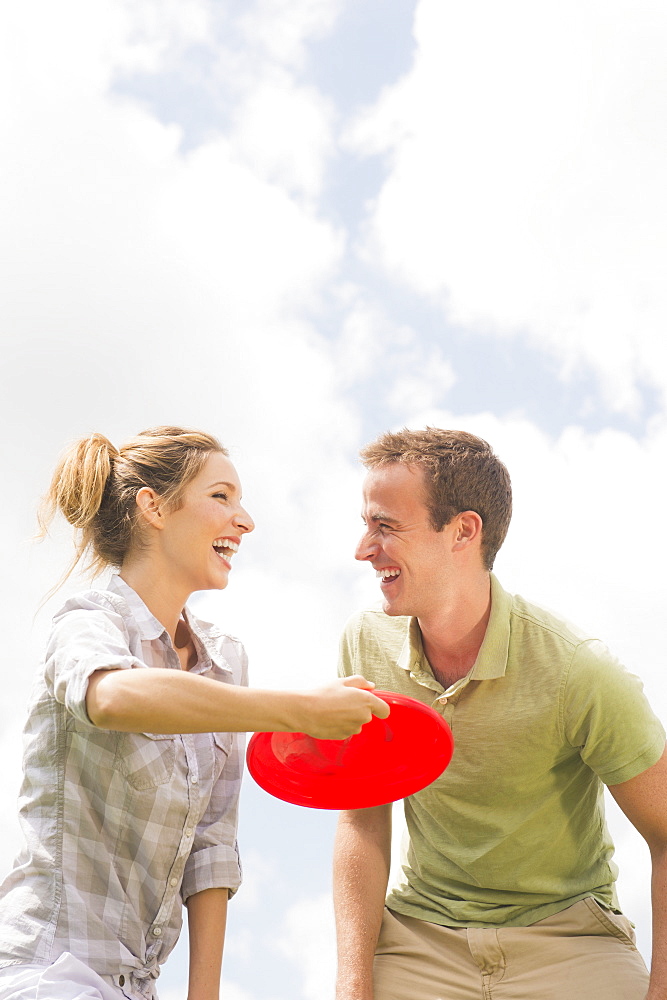 Couple playing with frisbee, USA, New Jersey, Mendham