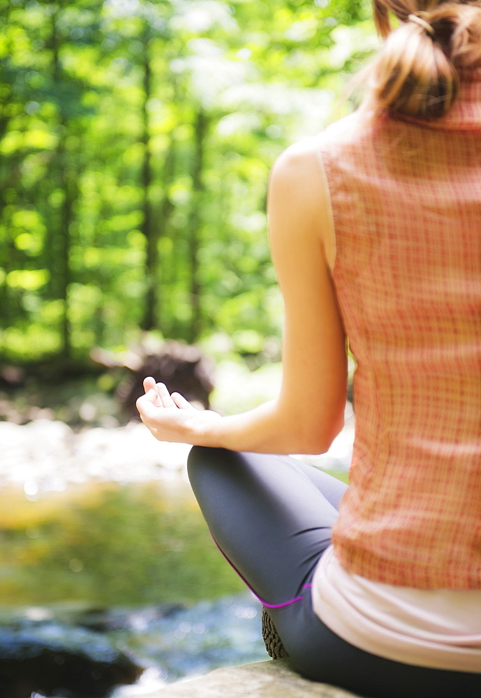 Woman practicing joga in forest, USA, New Jersey, Mendham