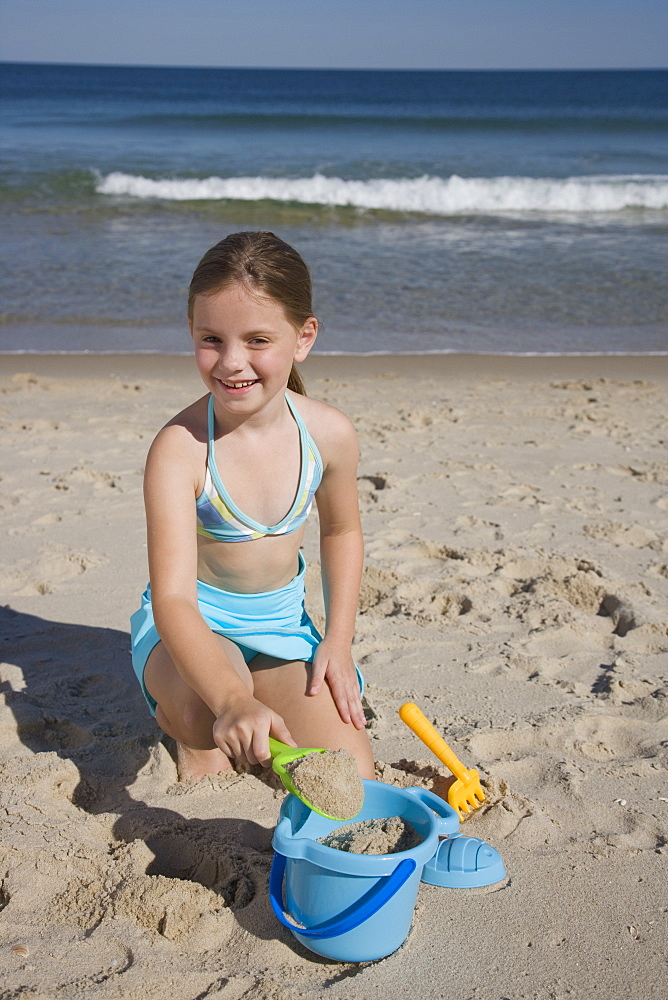 Girl playing in sand