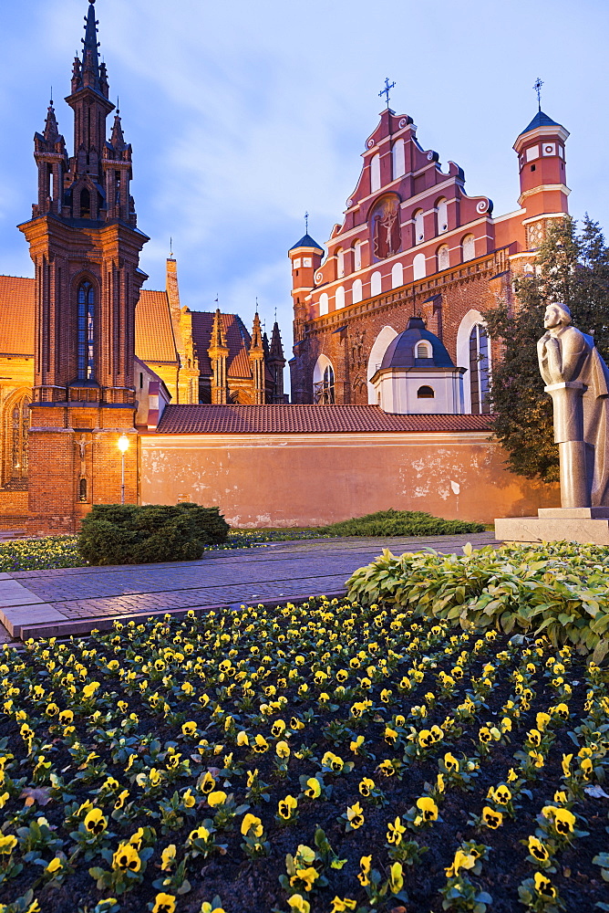 Saint Ann and Bernardine Churches at evening, flowers in foreground, Lithuania